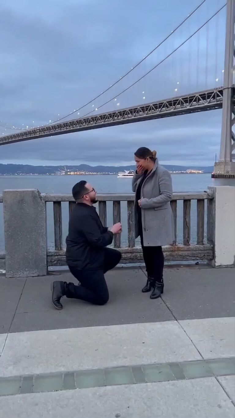The Proposal. San Francisco, Ca. with views of the East Bay Bridge in the background (visible from our Emerville apartment rooftop; the bridge was symbolic to our new beginning in the Bay Area). 

I had absolutely no clue it was coming, until it was here. I was completely in shock. I later found out through close friends that he had the ring since the start of the year...and was waiting for the right time to do it. Not pictured, we had two dear friends visiting, actually three if you count the baby that was brewing, who helped coordinate the night and capture the moment, quite beautifully as I might add.  Restaurant goers at the patio who witnessed the proposal cheered and applauded and our waiter greeted us with a champagne toast as we returned to our table for dinner at EPIC Steak. 