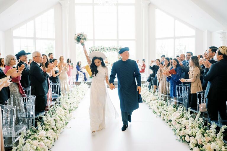 couple walking up the aisle after wedding ceremony