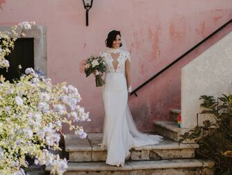 Photo of bride holding bouquet on steps