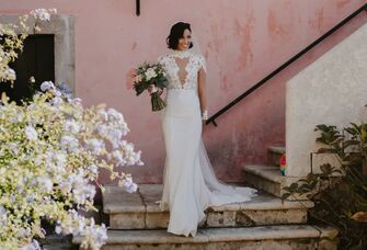 Photo of bride holding bouquet on steps