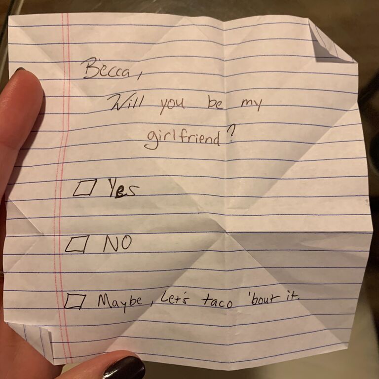 Daniel asked Becca to be his girl on the inside of a hand-crafted origami heart on taco night at Daniel's place.