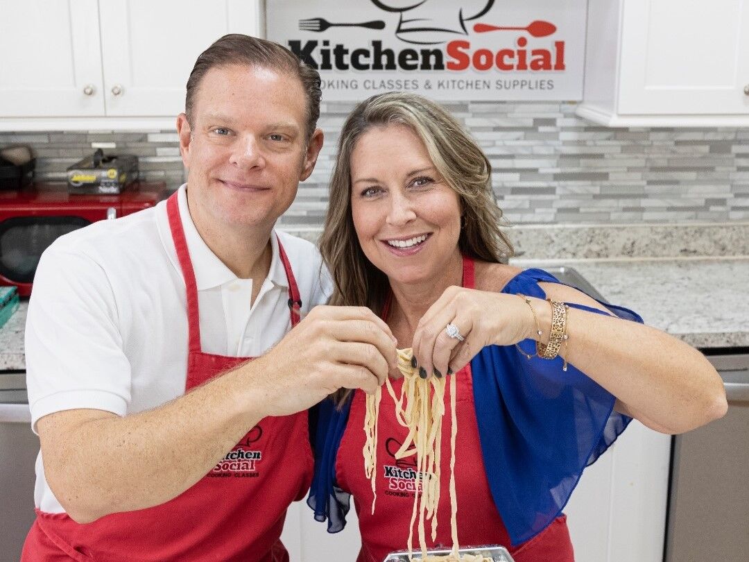 Happy couple making pasta together