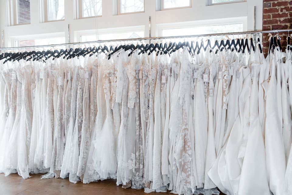 Rack of white wedding dresses from Wedding Angels Bridal Boutique in Atlanta