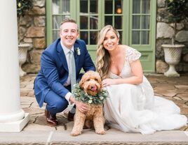 Happy couple on their wedding day with their pet