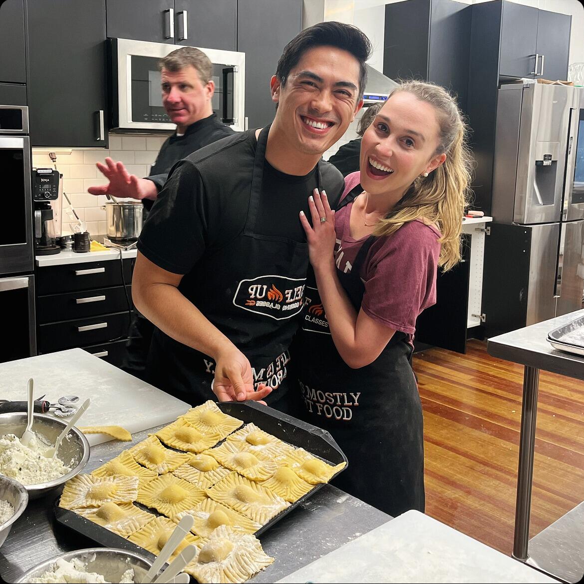Jaxon and Emily celebrate their first anniversary at a cooking class.  The teacher was a bit mean and can even be seen yelling at someone else in the back of this picture.