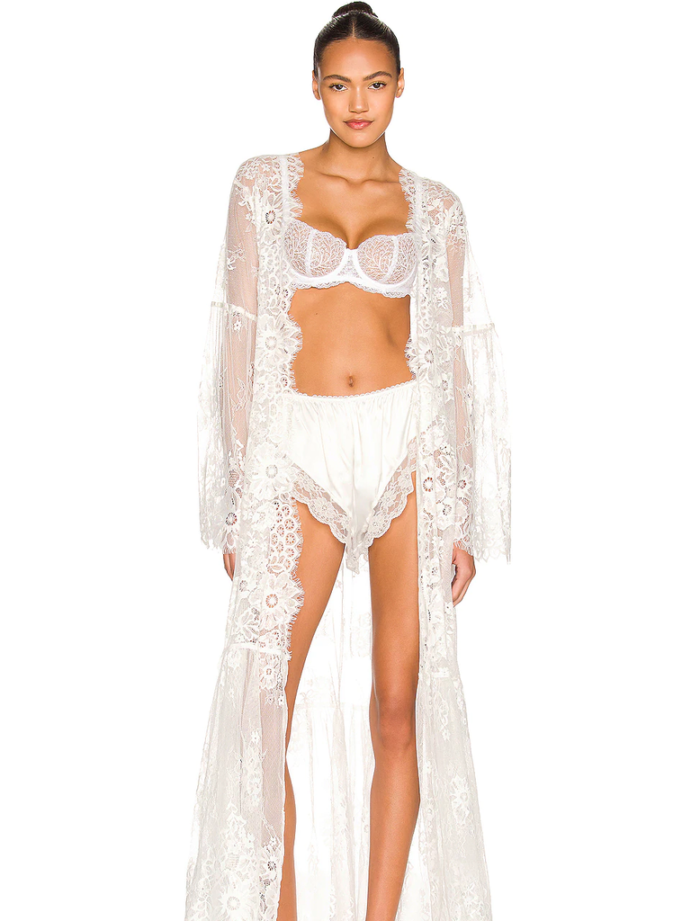 A model shows off this white and elegant Long Lace Wedding Robe.