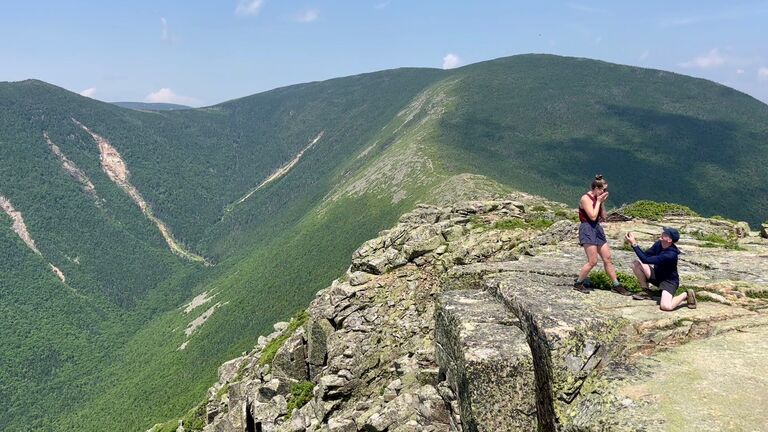 Engaged!  Dennis proposes to Angie on top of Mount Bondcliff in the White Mountains of New Hampshire. This was also the last hike Angie needed to complete all 48 peaks in New Hampshire over 4,000 feet!