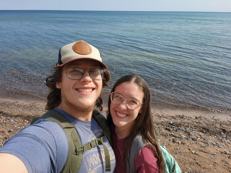 We took a camping trip to the "UP" (upper peninsula) in Michigan. In this photo we're standing on the beach of Lake Superior, where Jacob found the stone for the ring he made to propose with. 