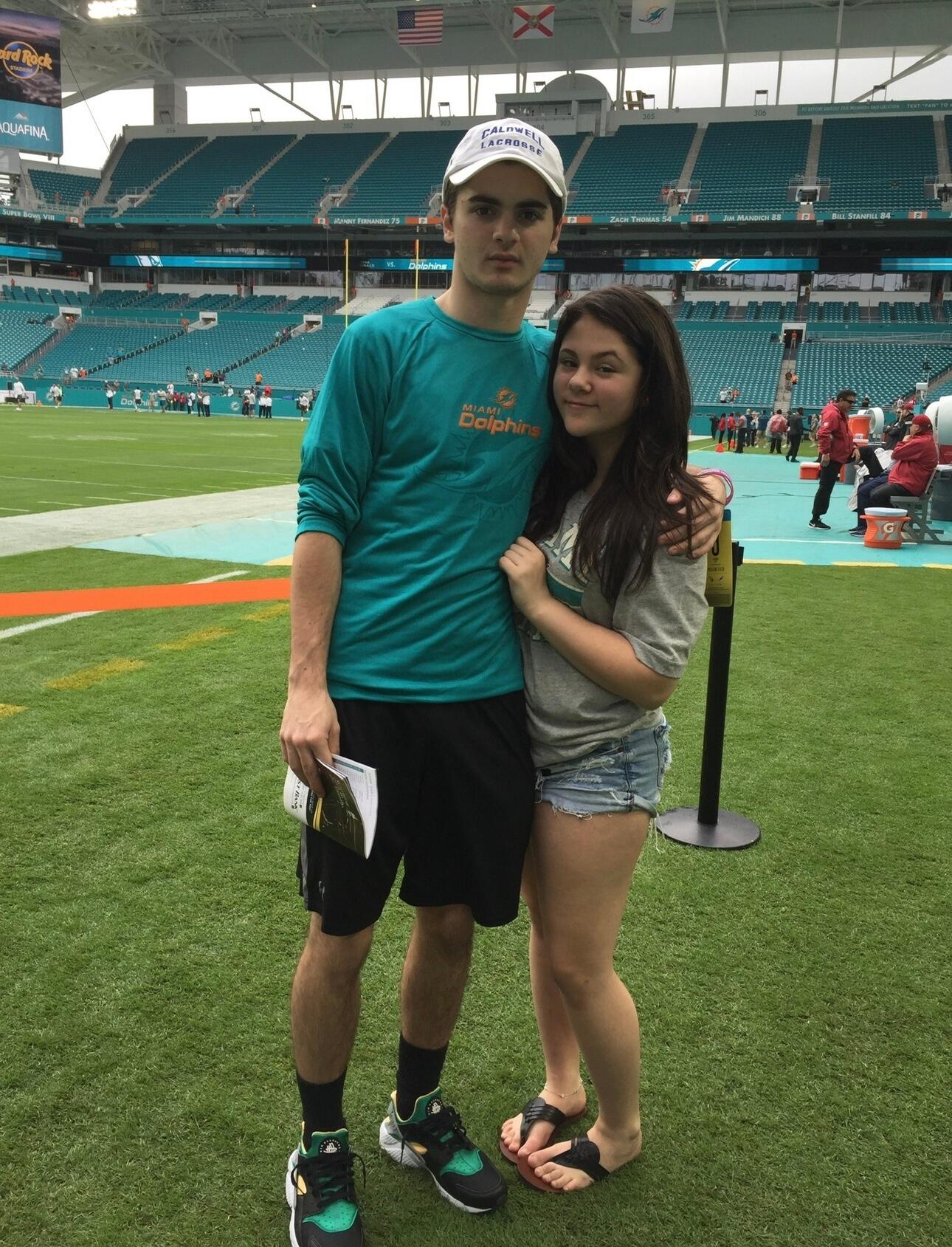 Our first trip together! We went with my parents to a Miami Dolphins game and got on the field. 