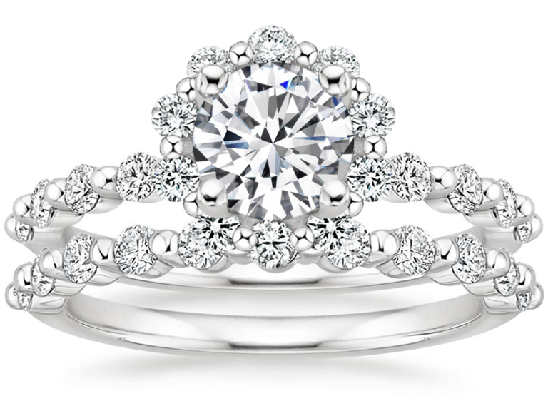 Marseille diamond with floral halo and matching bands