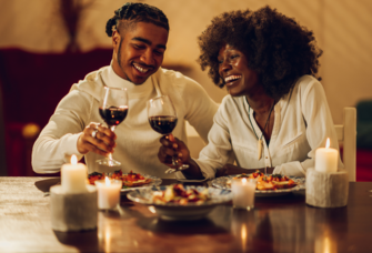 Couple enjoying dinner together with wine