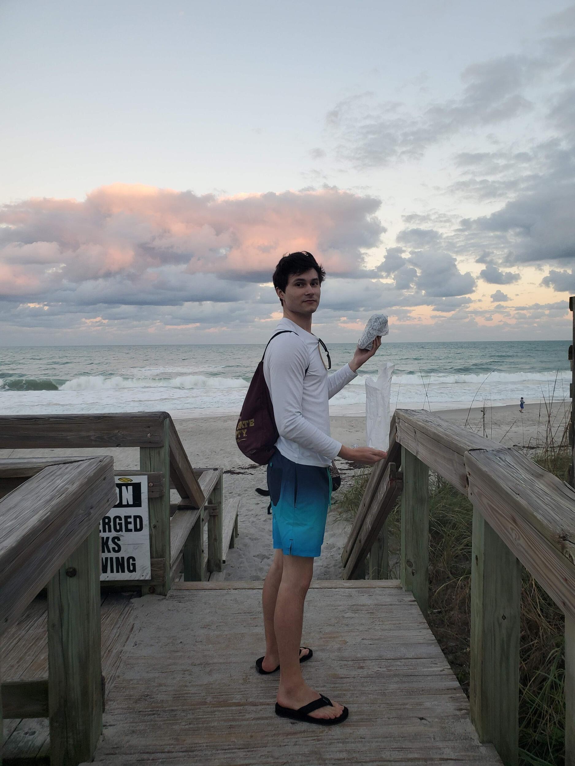 Jake embracing Florida on his first visit to meet Amanda's friends and family. Swim suit, FSU backpack, and a Publix sub on the beach? Amanda still swoons at this one. 