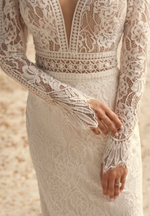 close up of long sleeve lace wedding dress with illusion bodice