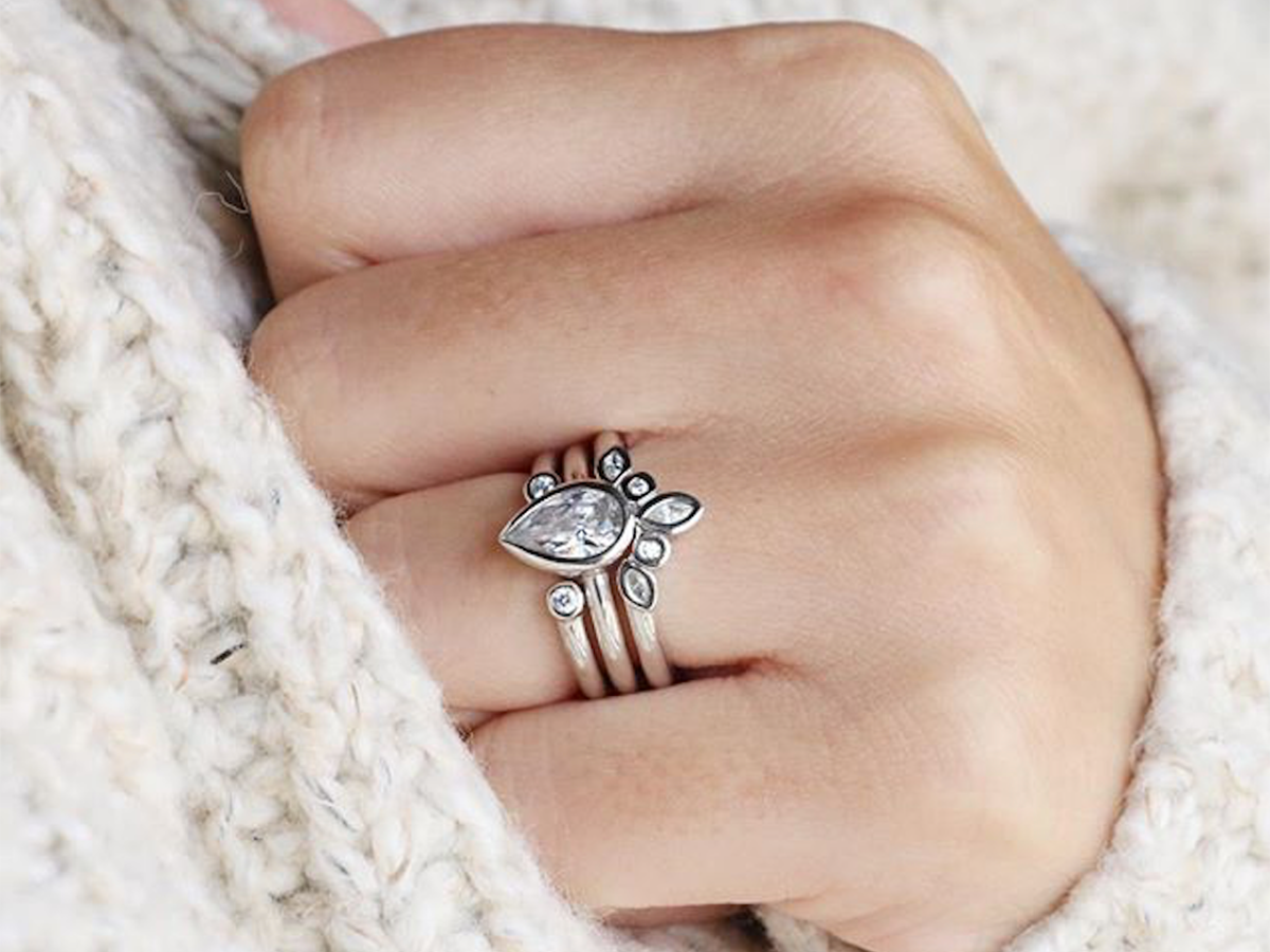 pear-shaped bezel engagement ring with nesting bands