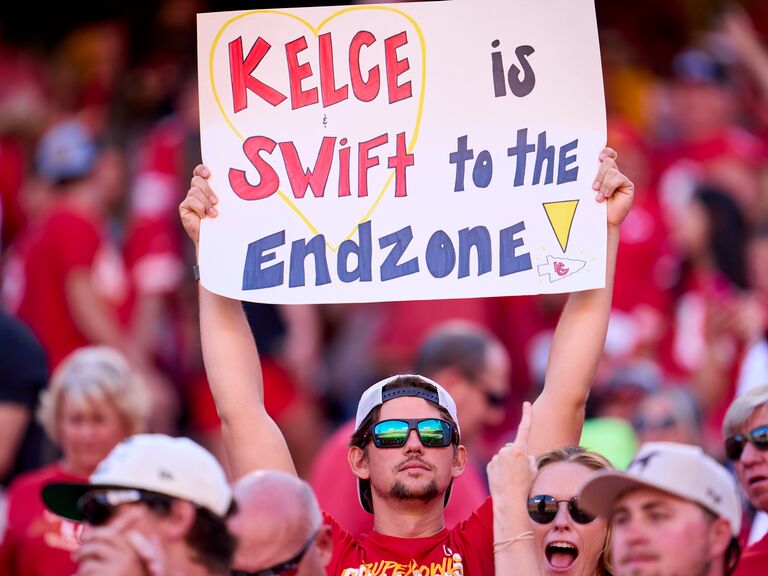 Fan holding a sign for Taylor Swift and Travis Kelce