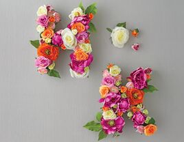 Initial monograms with silk flowers and cardboard letters