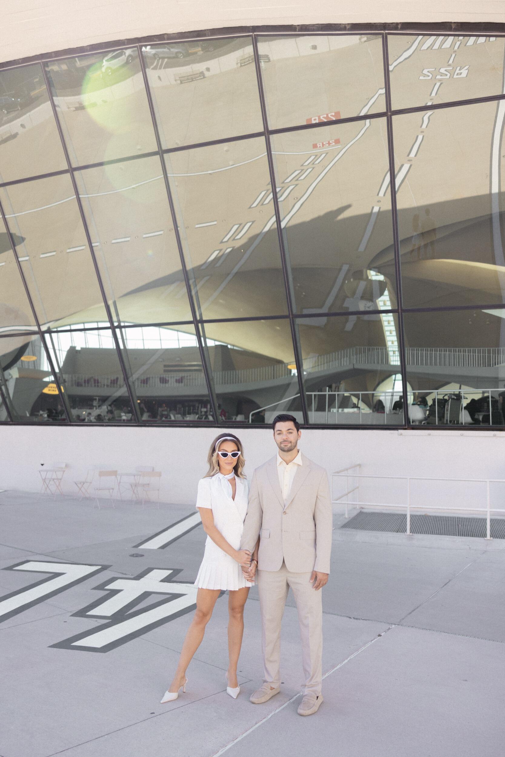 Lexi + Tyler shoot with their wedding photographer at the TWA Hotel! 