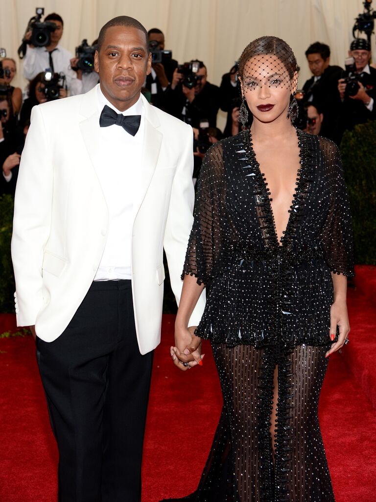 Beyonce and Jay-Z pictured hand in hand on the red carpet at the Met Gala. 