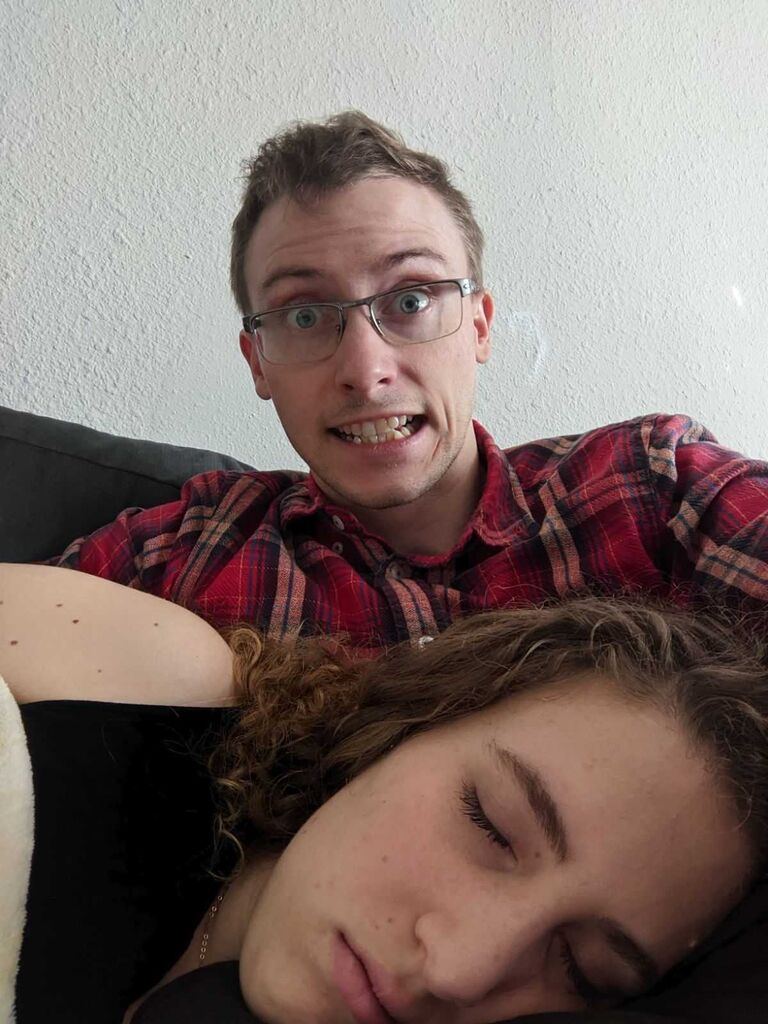 Matt often gets annoyed at the fact that I fall asleep while watching TV, playing computer games, and him reading out loud. Today he decided to take his revenge by getting this photo.