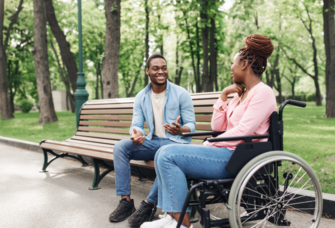 Husband and wife talking on park bench