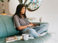 Woman using laptop, online wedding planners