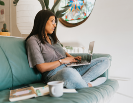 Woman using laptop, online wedding planners