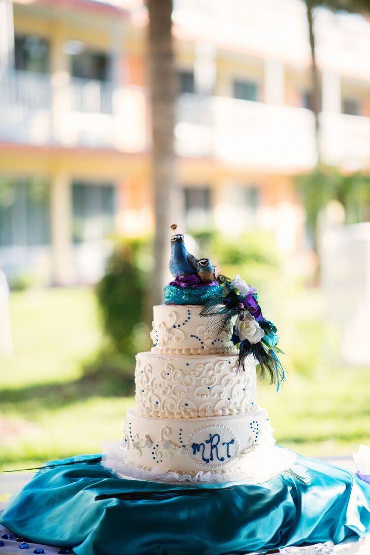 White Peacock Topped And Monogrammed Wedding Cake