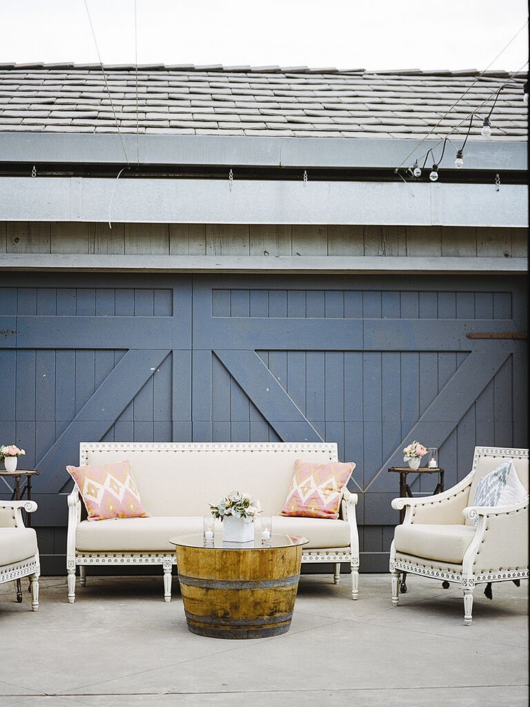 Lounge area with antique furniture and patterned pillows