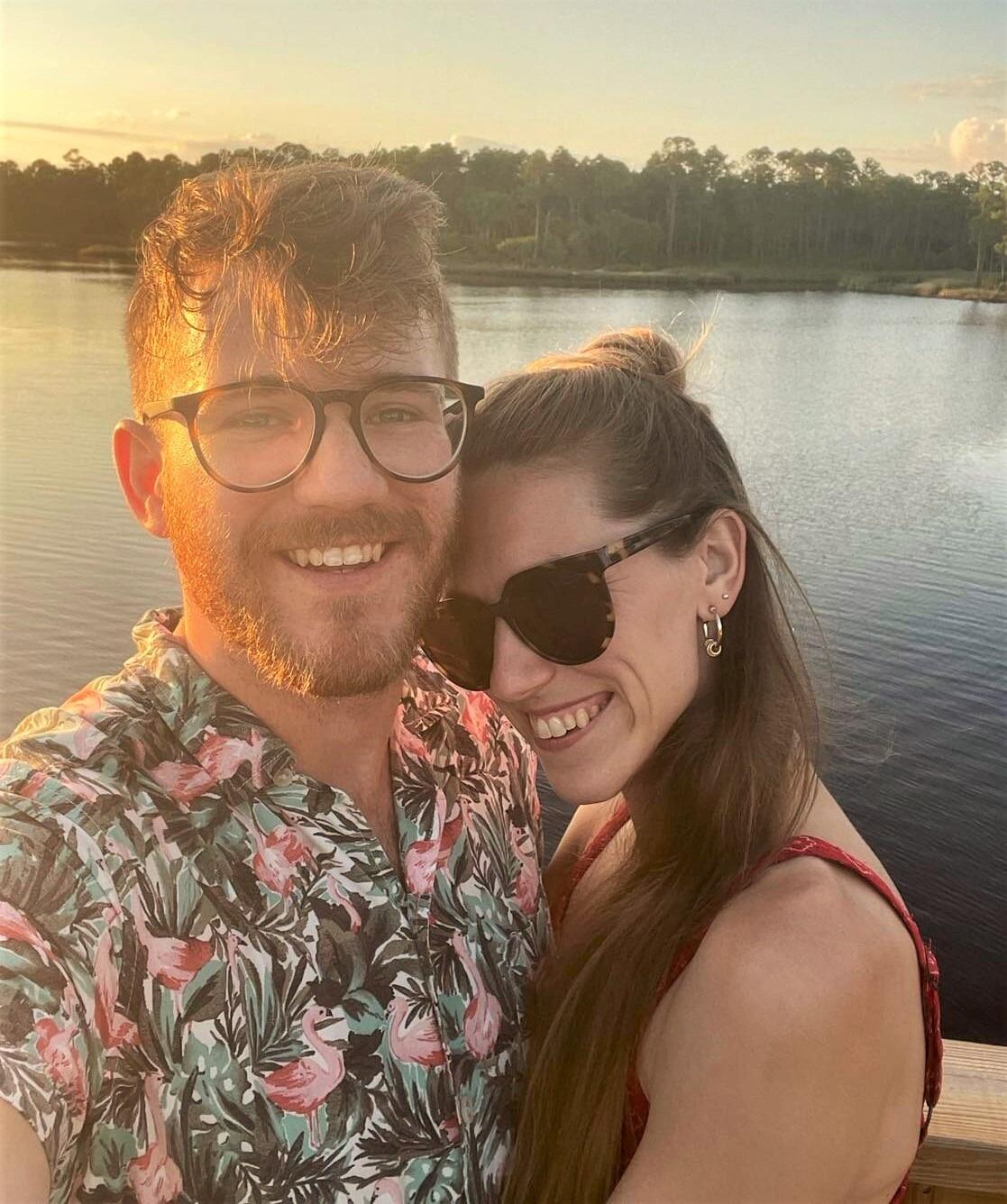 Kara and Alex love a beautiful sunset over the water while enjoying family vacation at Santa Rosa beach.