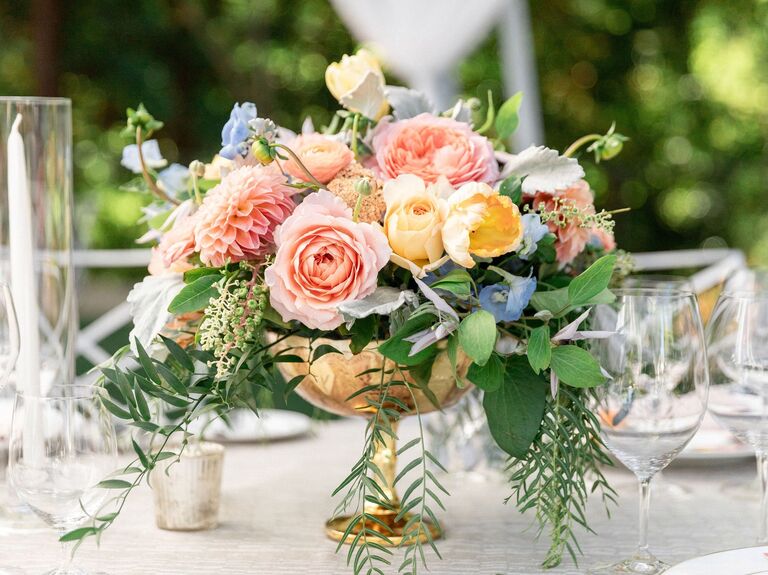 A stunning bouquet graces a wedding table, showcasing the colors of the season.