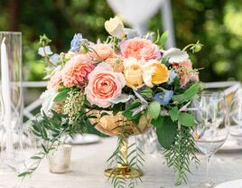 A stunning bouquet graces a wedding table, showcasing the colors of the season.