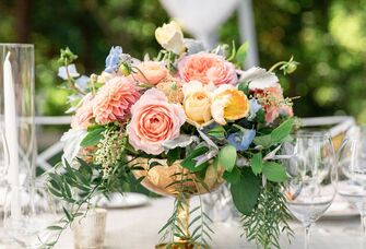 A stunning bouquet graces a wedding table, showcasing the colors of the season.
