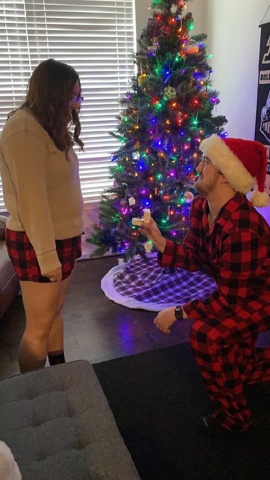 Engagement Day! Evan surprised Amber by getting down on one knee while taking Christmas card photos 