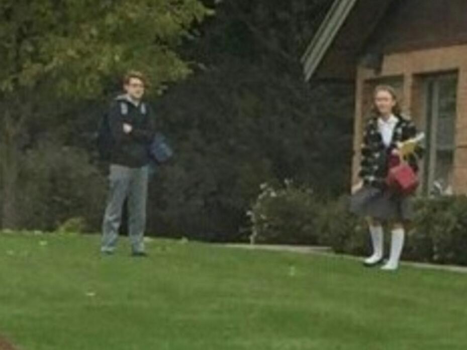 Here is a funny picture of them standing approximately half a football field away from each other early that fall.  Alex already really liked her at this point, hence the distance.