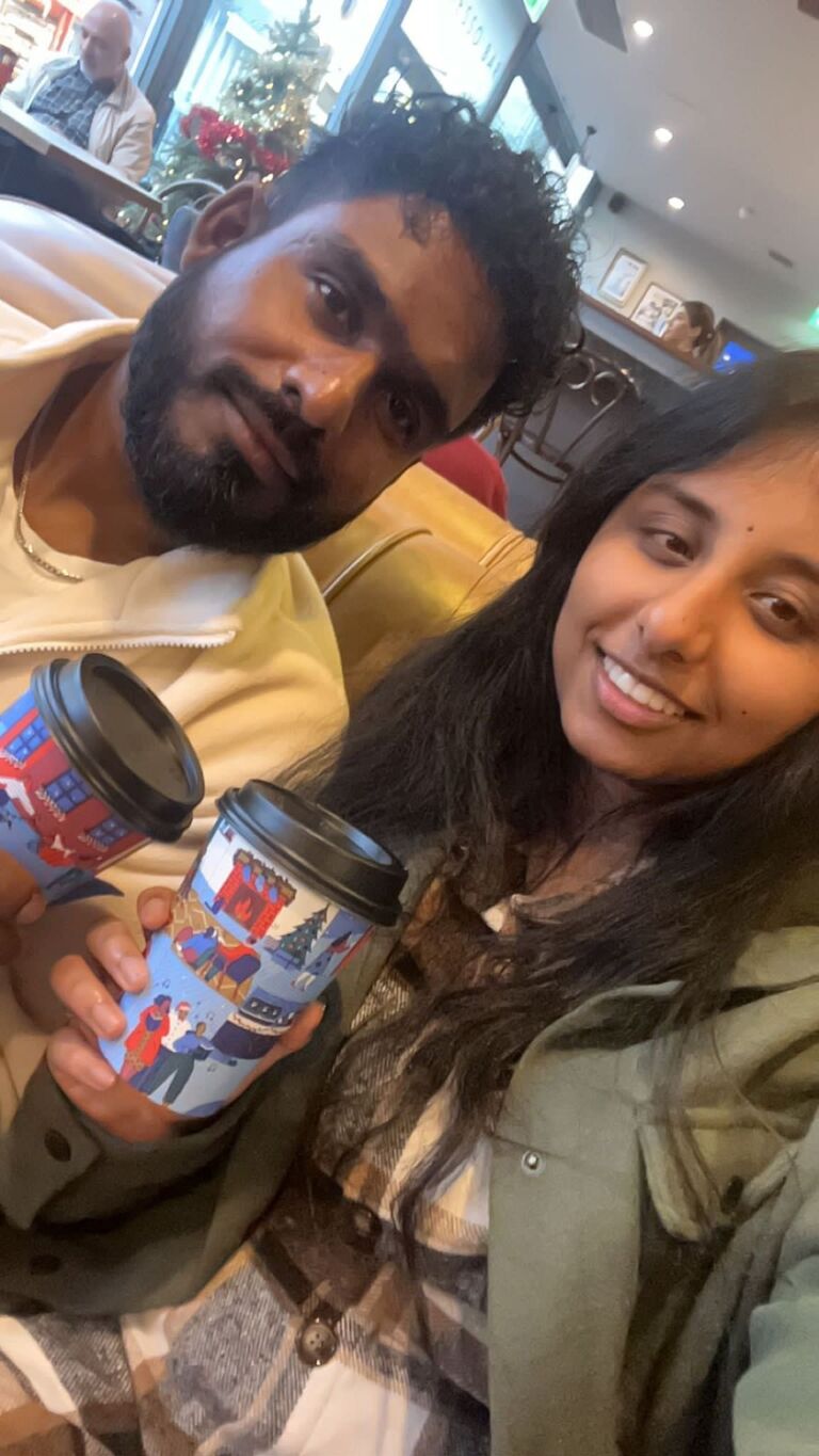 Thulashi pretending to enjoy coffee, because I love my coffee