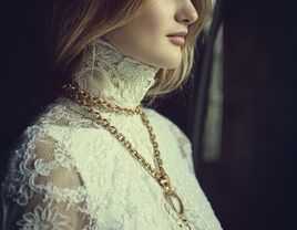 Theia wedding dress and cape with a vintage Chanel necklace