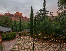 L'Auberge de Sedona skyline and garden terrace event venue string lights and red rock formations backdrop
