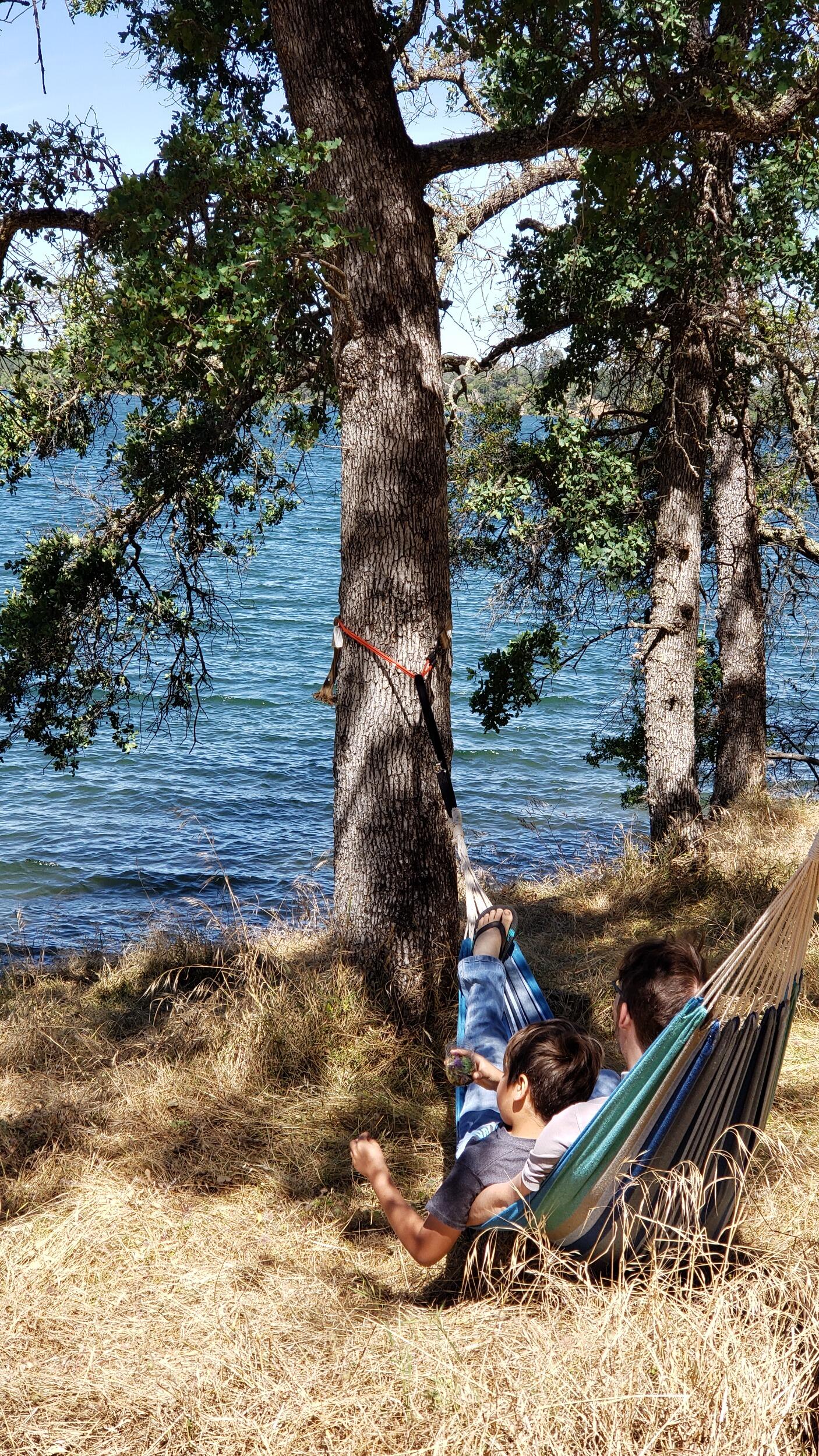 Lake Folsom was their first family camp out. Kyler and Adan are relaxing in the hammock by the lake.