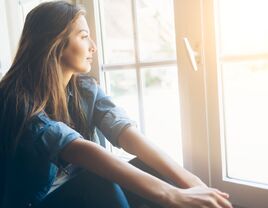 Woman looking out the window