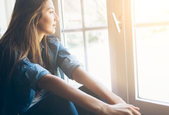 Woman looking out the window