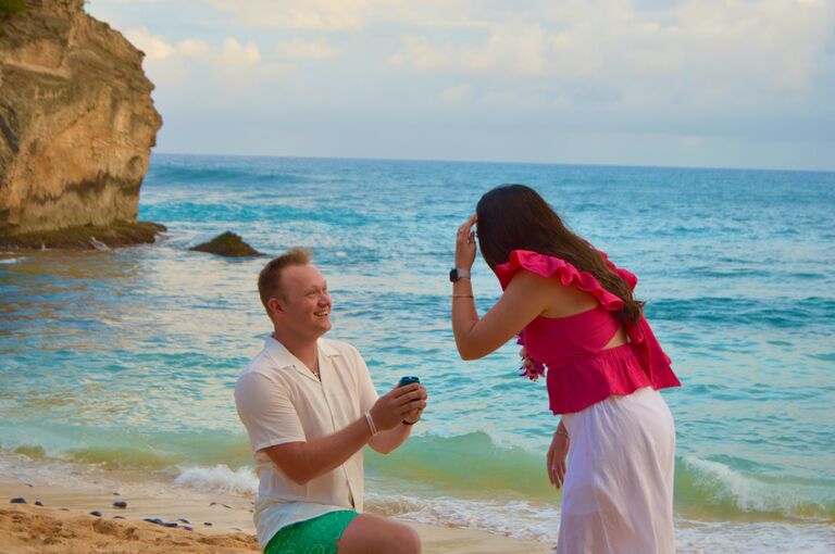 Jonah got down on one knee and popped the question at Shipwrecks Beach in Kauai!