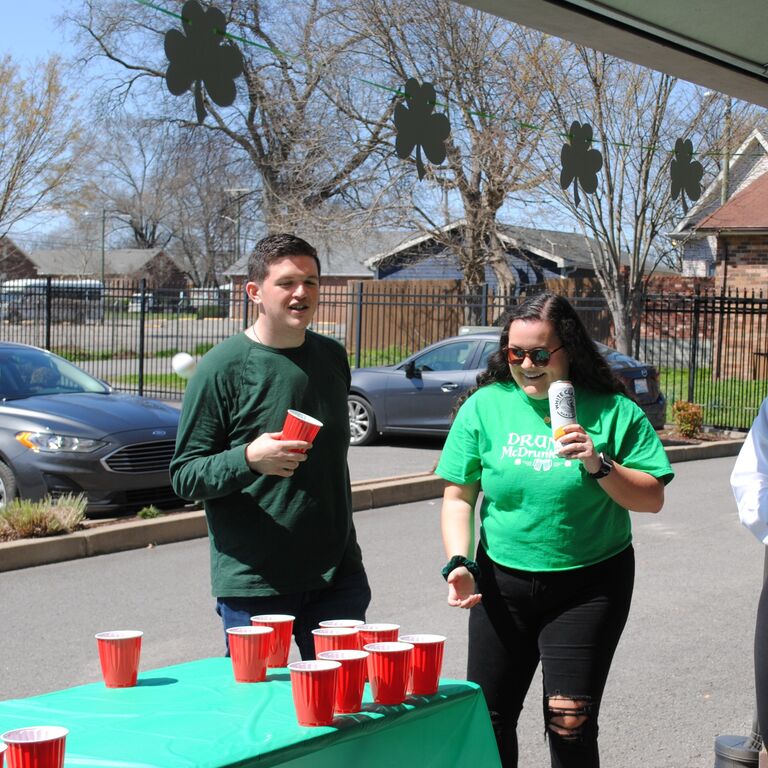 Their first outing as a couple was to a St. Patrick's Day party where Jared met all of KJ's OT school friends and proved himself as a good party game partner