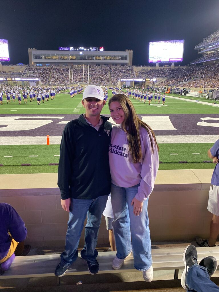 Sophia attended her first Kansas State football game with Justin.