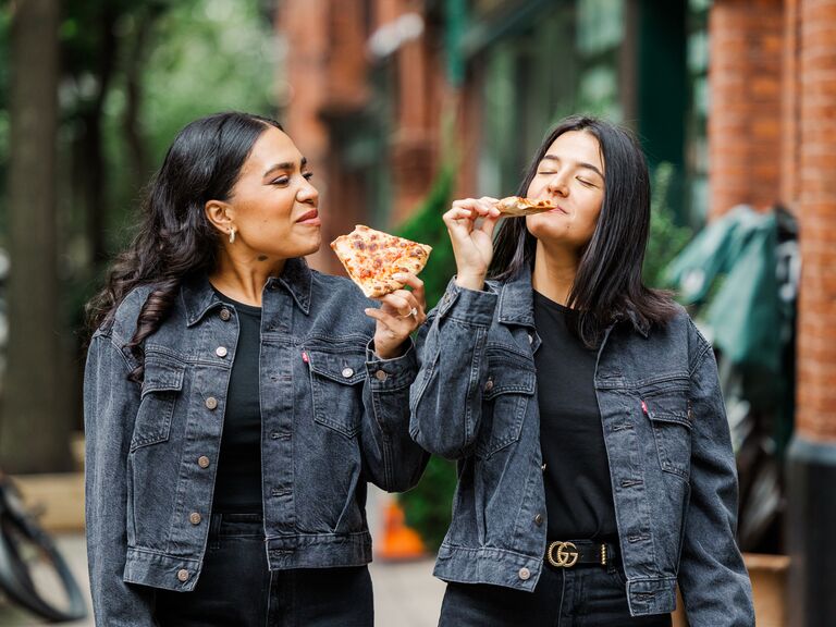 Couple eats pizza during their summer engagement photo session. 