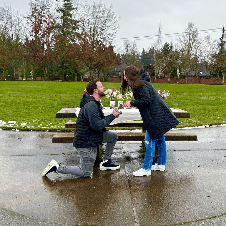 As I'm sure you can imagine, after 10 years together Claire had been patiently waiting for this day for a long time. Nathan planned a special date for Claire that started out with a rainy walk through their favorite hometown park that they grew up going to. As they rounded the corner to an all too familiar bench, Nathan popped the question and officially asked Claire to marry him! This spot was so special for them because this is where Nathan had asked Claire to be his girlfriend all those years ago.