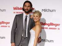 Kaley Cuoco-Sweeting and Ryan Sweeting pose together at an event