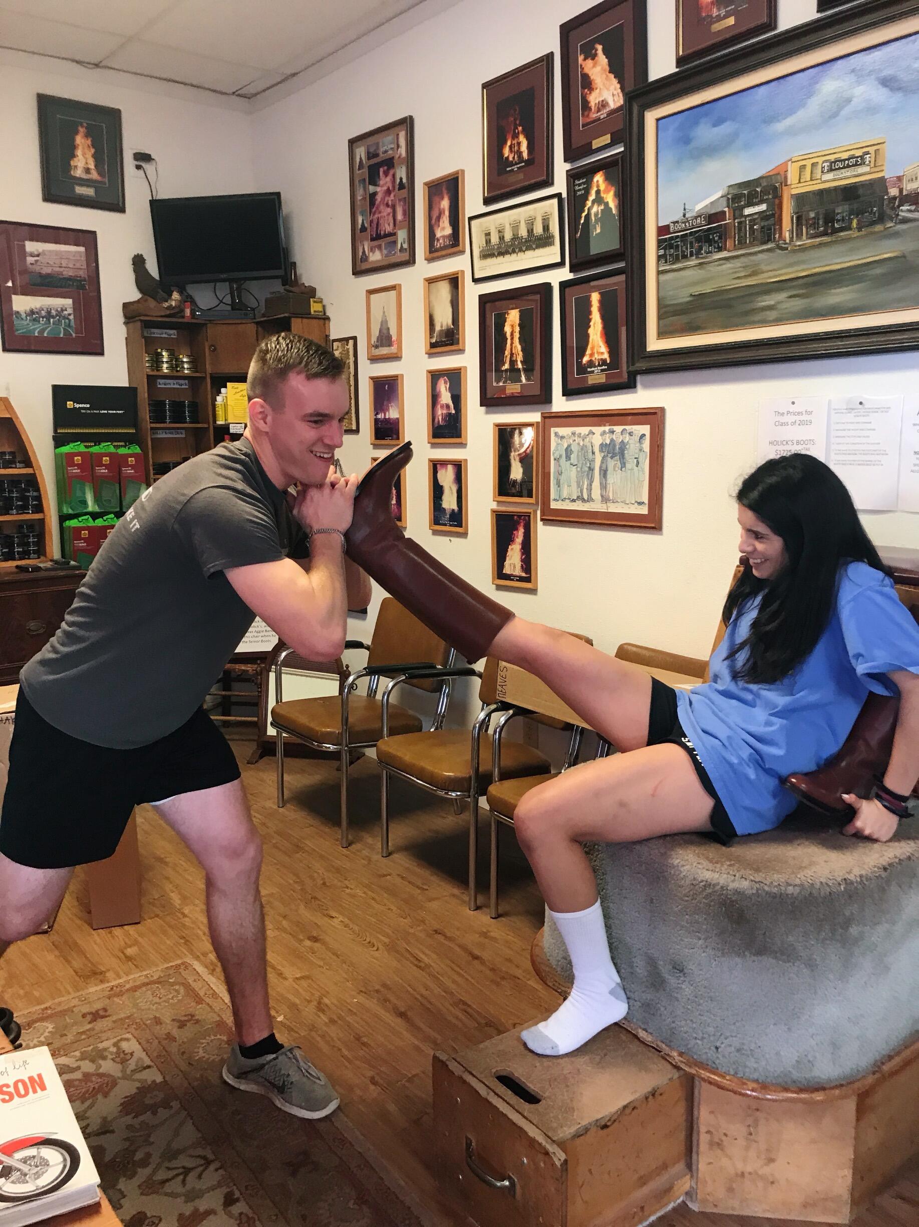 Wyatt pulling off Gabby’s senior boots.  