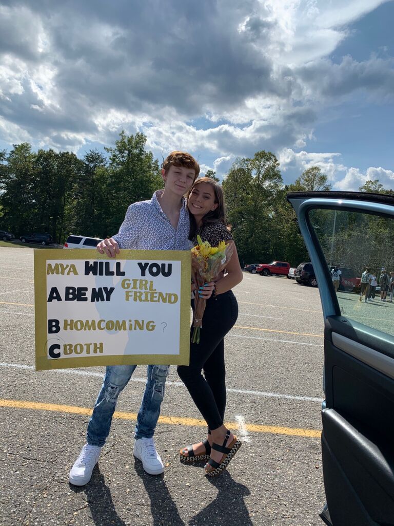 Clint asked if I would be his homecoming date and his girlfriend.