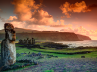 The lone moai at Tongariki with the Ahu Tongariki moai in the background on Easter Island, Chile