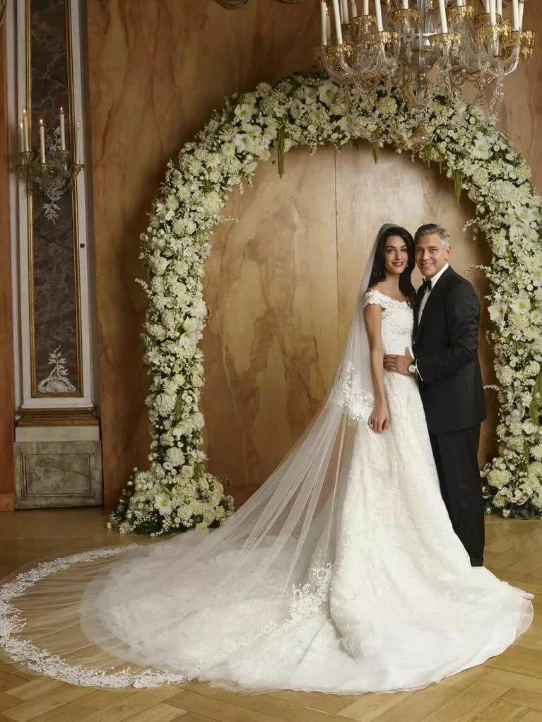 George and Amal Clooney posing together on wedding day